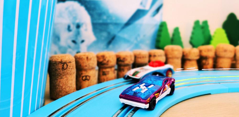 a toy car racing on a track